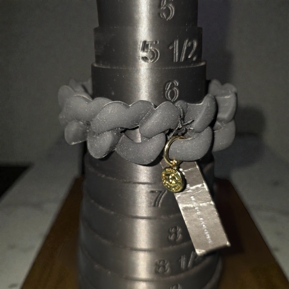 Marc Jacobs Jewelry - Marc Jacobs Black Bracelet with Gold Charm